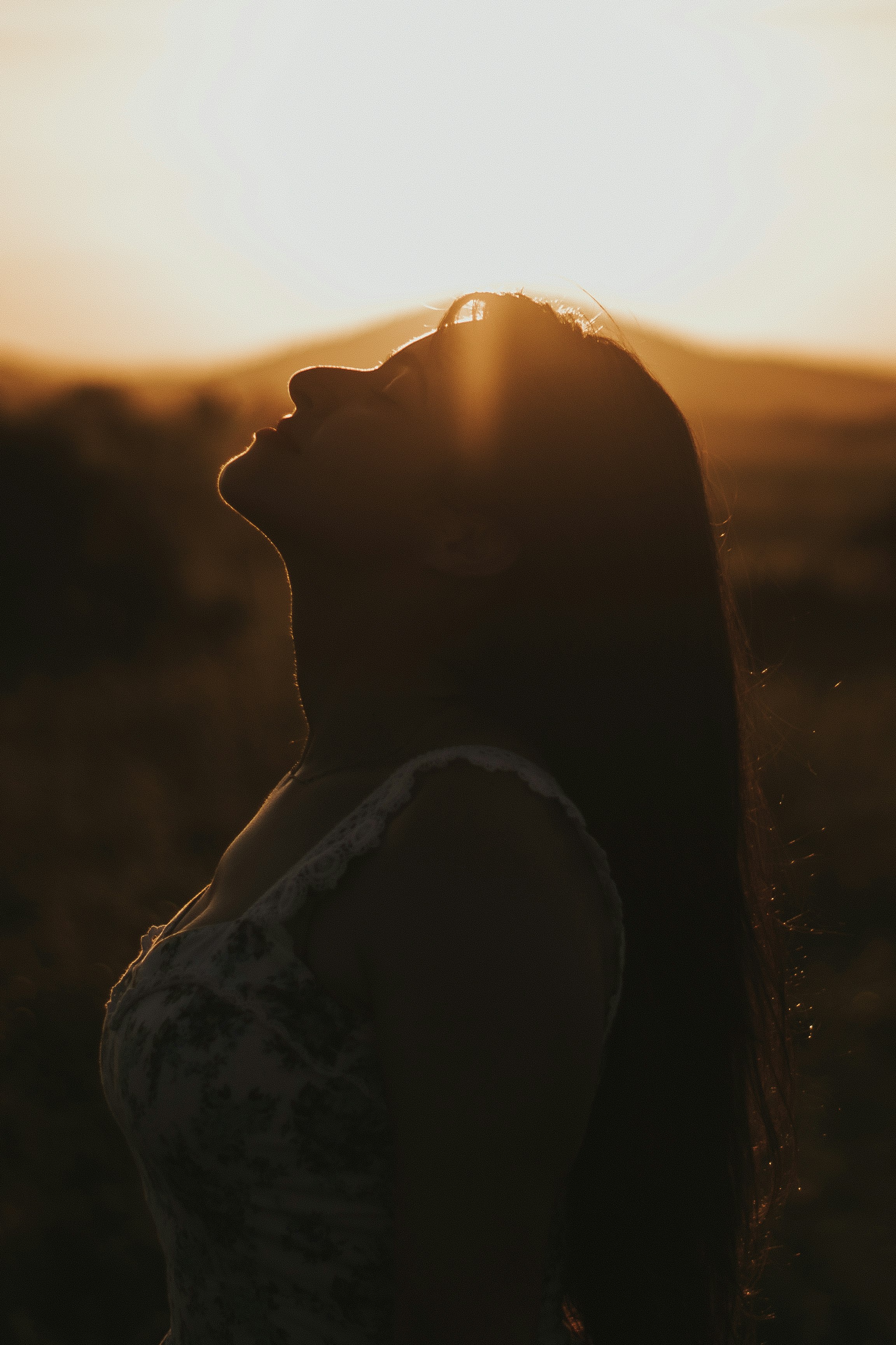 silhouette of woman during sunset